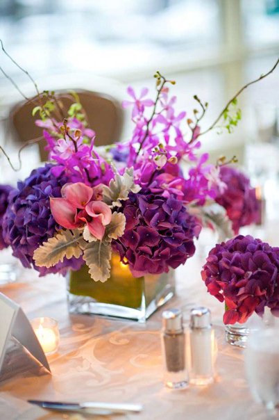 Purple and Magenta Table Arrangements Photo by Zev Fisher